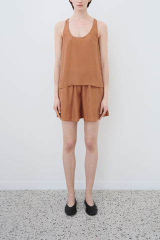 HERTH Hani shorts in earth habotai silk — sustainable organic silk womenswear crafted in Italy, available at ASSOLUTO Boutique.